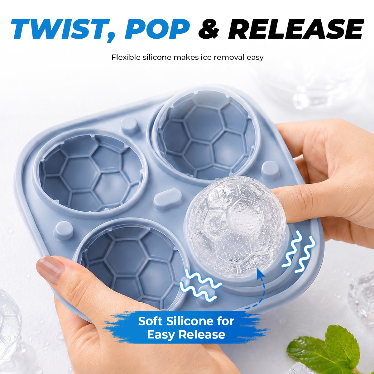 Flexible silicone tray being twisted to release a soccer ball ice cube